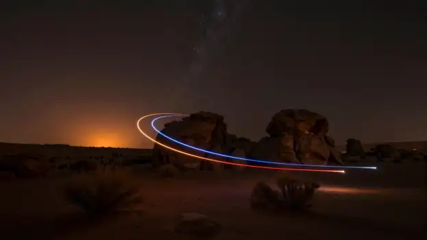 Desert Landscape at Night with Light Trails rock formations