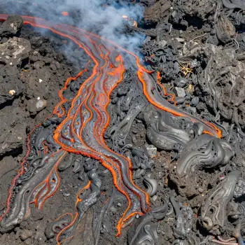 Lava Flow on Rocky Surface volcano smoke orange lava