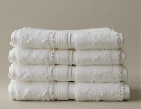 Neatly Folded White Towels Stack textured frayed hotel