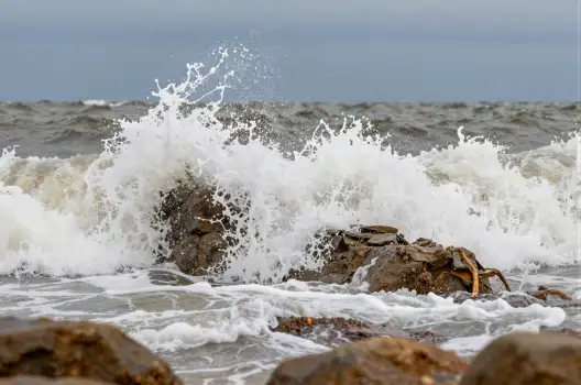 Dramatic Rocky Shoreline with Turbulent Waves