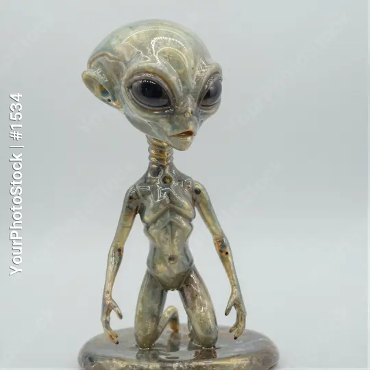 Alien Figurine Standing with Outstretched Arms