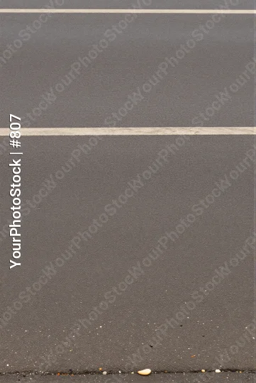 Smooth Grey Surface with Blurred Lines and Dirt concrete parking asphalt