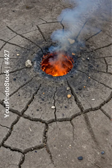 Crack in the Ground with Burning Liquid and Smoke