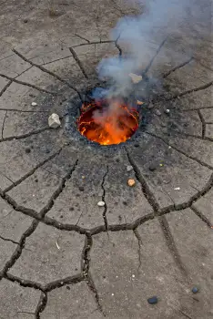 Crack in the Ground with Burning Liquid and Smoke