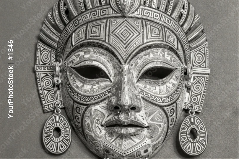 African Traditional Metal Mask with Intricate Patterns
