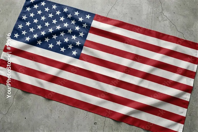 American flag lying on concrete floor stars and stripes