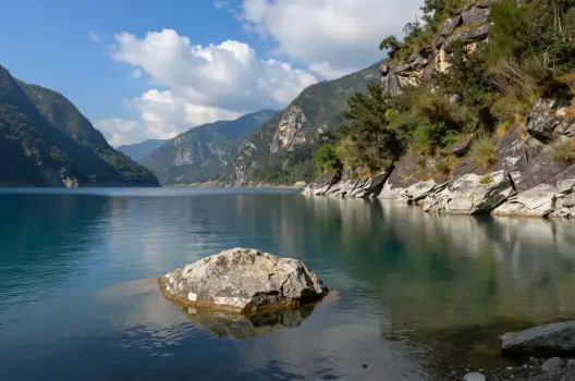 Calm Lake Surrounded by Mountains landscape serene