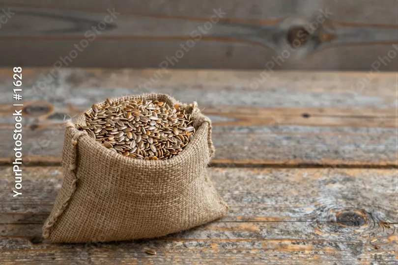 Rustic Wooden Table with Sunflower Seeds burlap sack