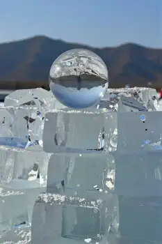Crystal Ball Floating on Ice Pyramid peaceful