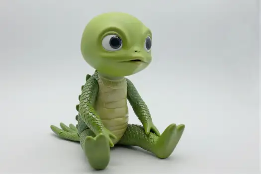 Green Alien Toy Sitting on White Background round eyes