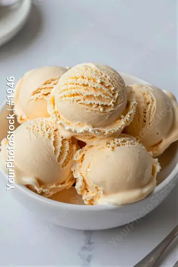 Vanilla Ice Cream Scoops in Bowl light peach orange zest