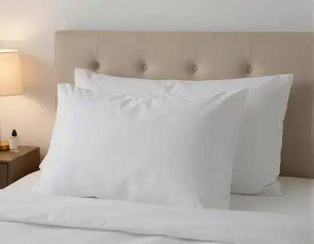 Minimalist Bedroom Setup With Pillows And Lamp hotel