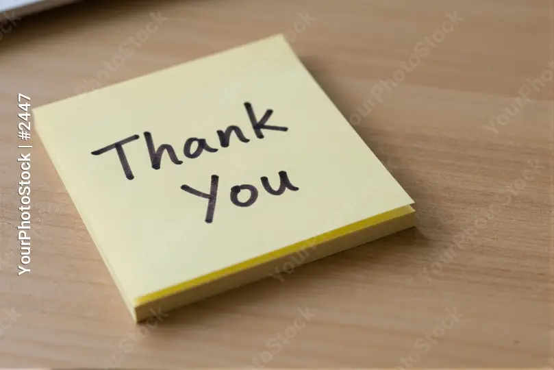 Thank You Sticky Note on Wooden Desk business card
