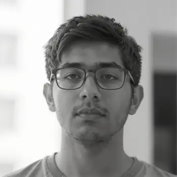 Young Man in Serious Pose with Curly Hair black and white