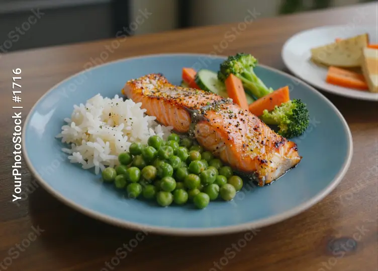 Blue Plate with Salmon, Rice and Vegetables on Wooden Table