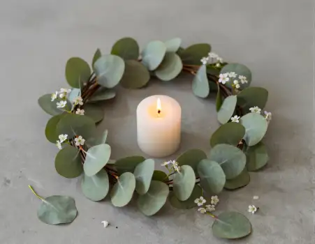 Minimalist Eucalyptus Wreath with Lit Candle Flat Lay