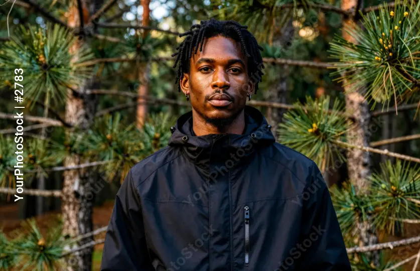 Portrait of a Young Black Man with Natural Hair in an Outdoor Setting