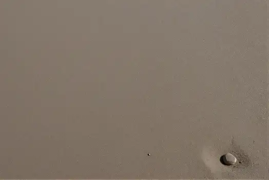 Close-up of Beige Surface with Hole and White Object concrete