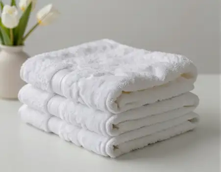 Neatly Folded White Towels Stack surface vase hotel