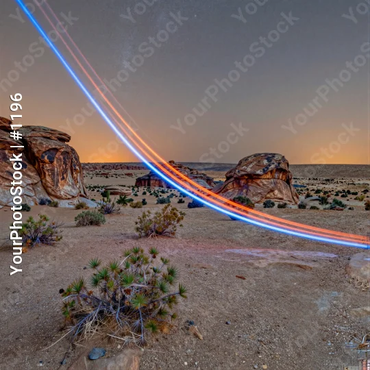 Desert Landscape with Light Trails at Sunrise