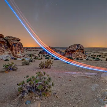 Desert Landscape with Light Trails at Sunrise