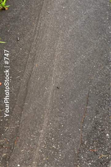 Uneven Asphalt Road with Debris scattered urban