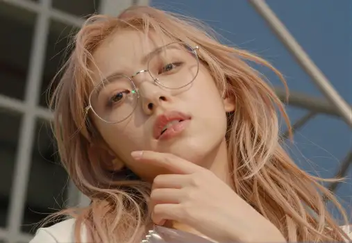 Serious Young Woman with Blonde Hair and Glasses Deep in Thought asian