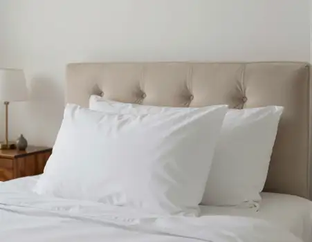 White Bed with Tufted Headboard in Neutral Room hotel