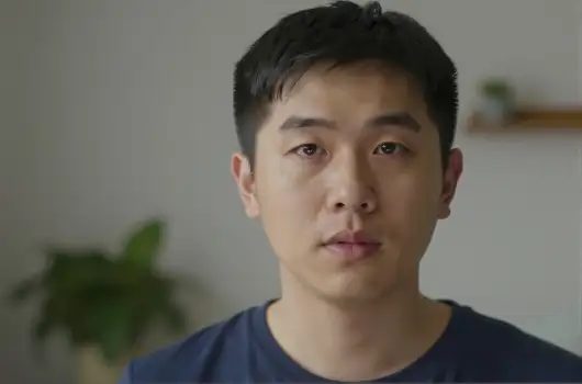 Young Asian Man in Serious Look close-up portrait