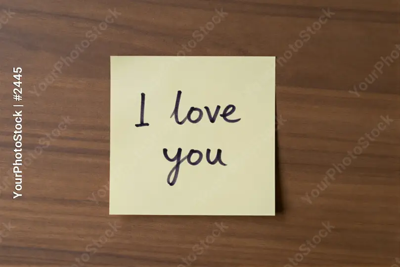 Love Note on Wooden Surface sticky note cursive text