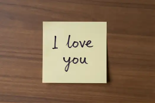 Love Note on Wooden Surface sticky note cursive text