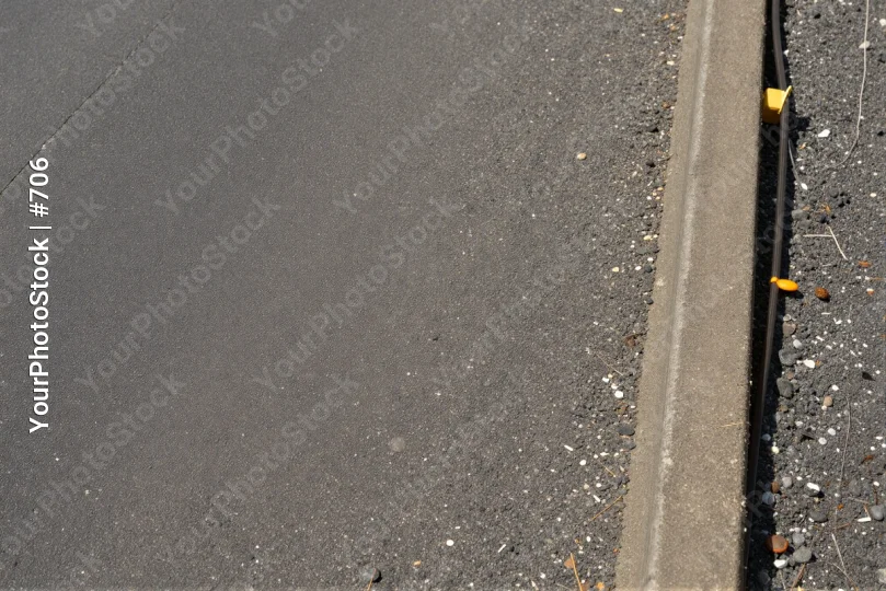 Freshly Paved Road with Caution Tape asphalt paving