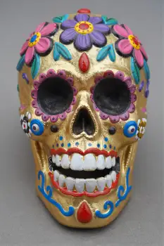 Day of the Dead Skull Mask with Golden Paint and Flowers Mexico