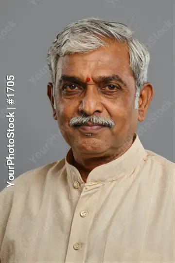 Indian Man in Traditional Outfit with Bindi serious expression
