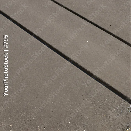 Close-up of Light-Colored Concrete Floor with Diagonal Lines