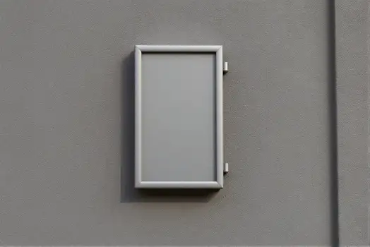 Metal Box Attached to Gray Wall white box screws