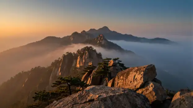 Mountain Range at Sunrise/Sunset with Fog landscape