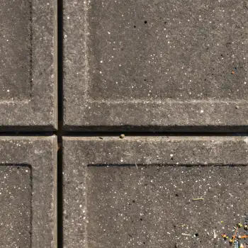 Four Rough Grey Tiles Close-Up grid holes concrete