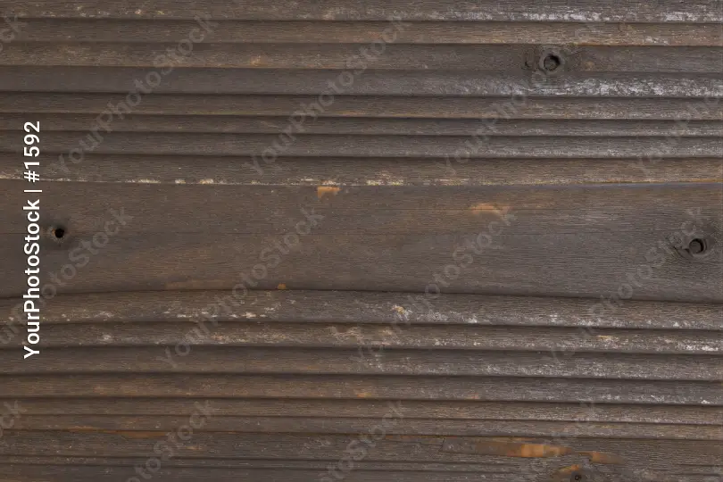 Weathered Wooden Surface with Cracks and Holes