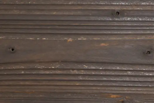 Weathered Wooden Surface with Cracks and Holes