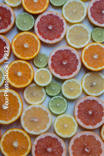 Sliced Oranges and Limes on White Background fruit arrangement