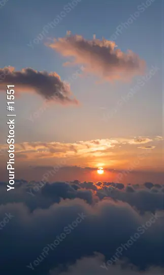 Serene Sunset Over Ocean blue sky calm water white clouds