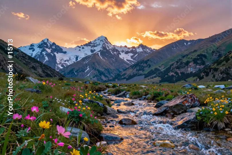 Mountain Range at Sunset with Snow-Capped Peaks