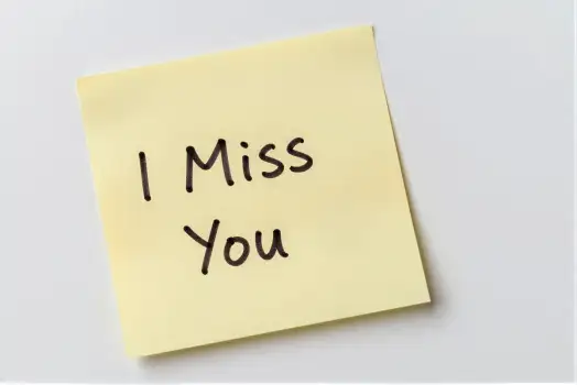 Yellow Sticky Note with 'I Miss You' Cursive Text