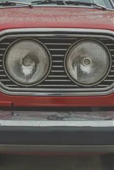 Red Car Grille with Worn Headlights chrome street