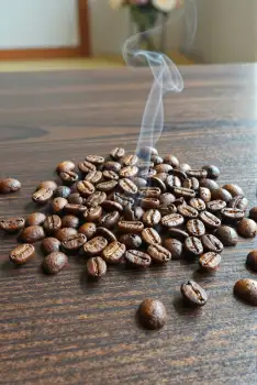 Freshly Roasted Coffee Beans on Wooden Table fresh roasted
