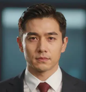 Professional Man in Slicked-Back Hair Looking Directly at Camera business