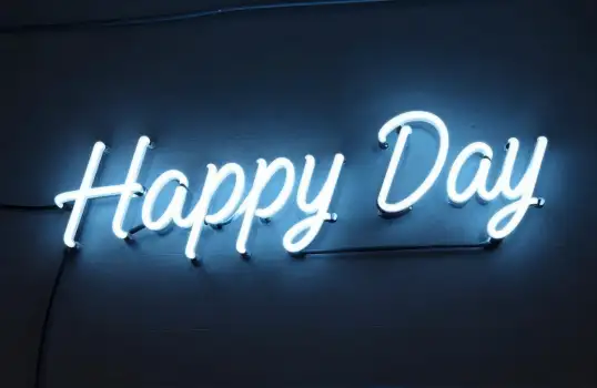 Neon Sign 'Happy Day' Glowing on Dark Background