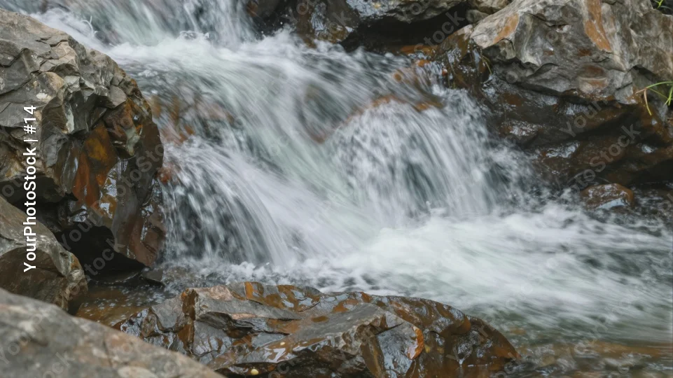 Waterfall in the rocks, nature movement fluid