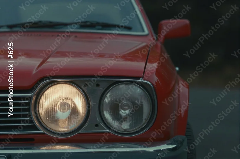 Vintage Red Car Grille and Headlights sleek design